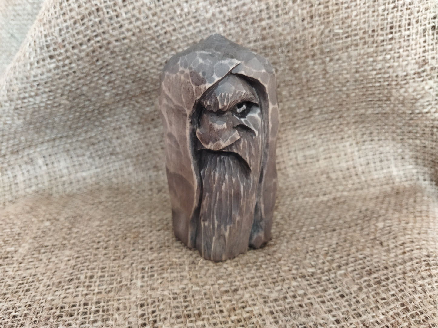 Odin statue. Wood carving. Scandinavian mythology.