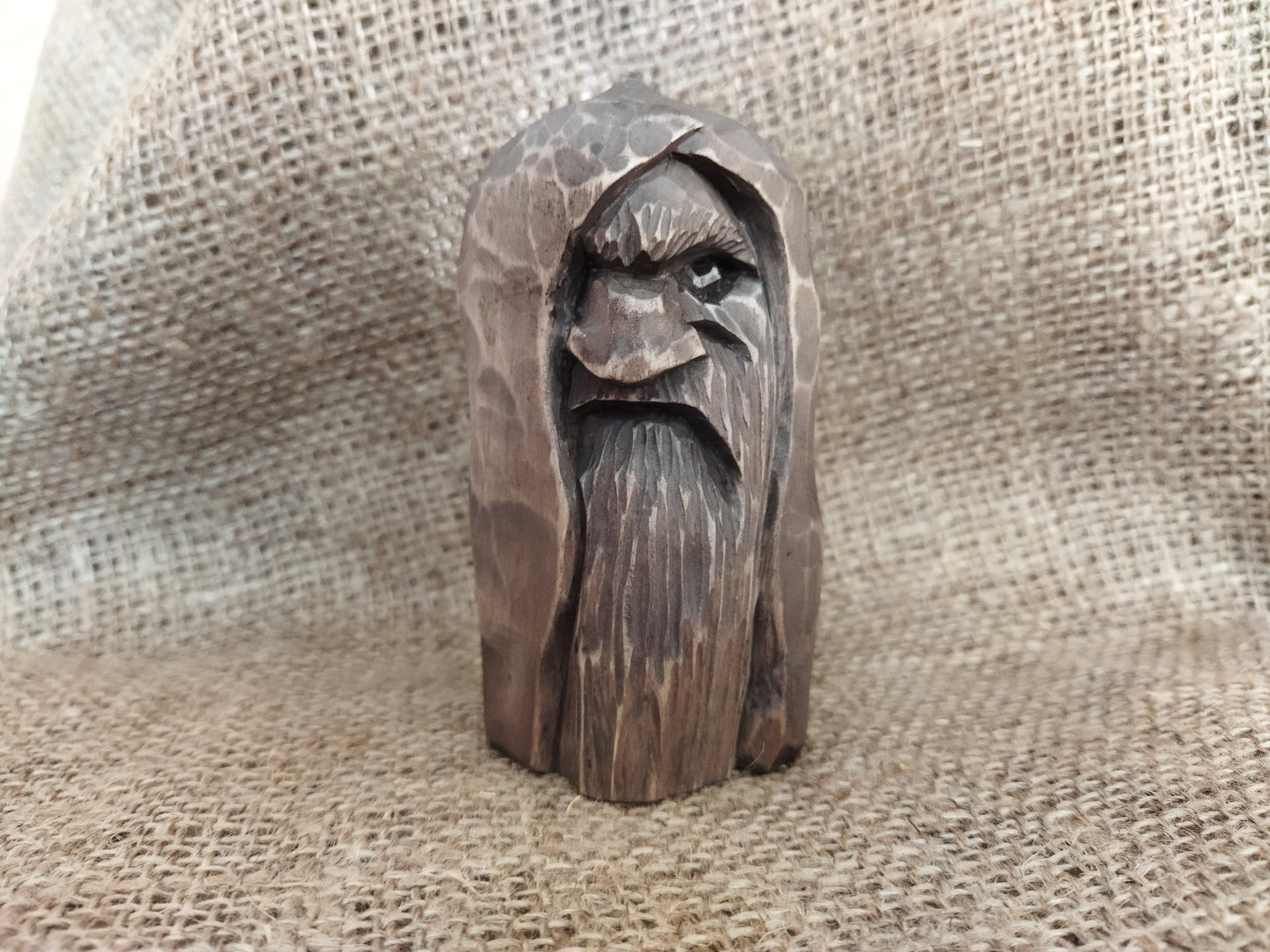 Odin statue. Wood carving. Scandinavian mythology.