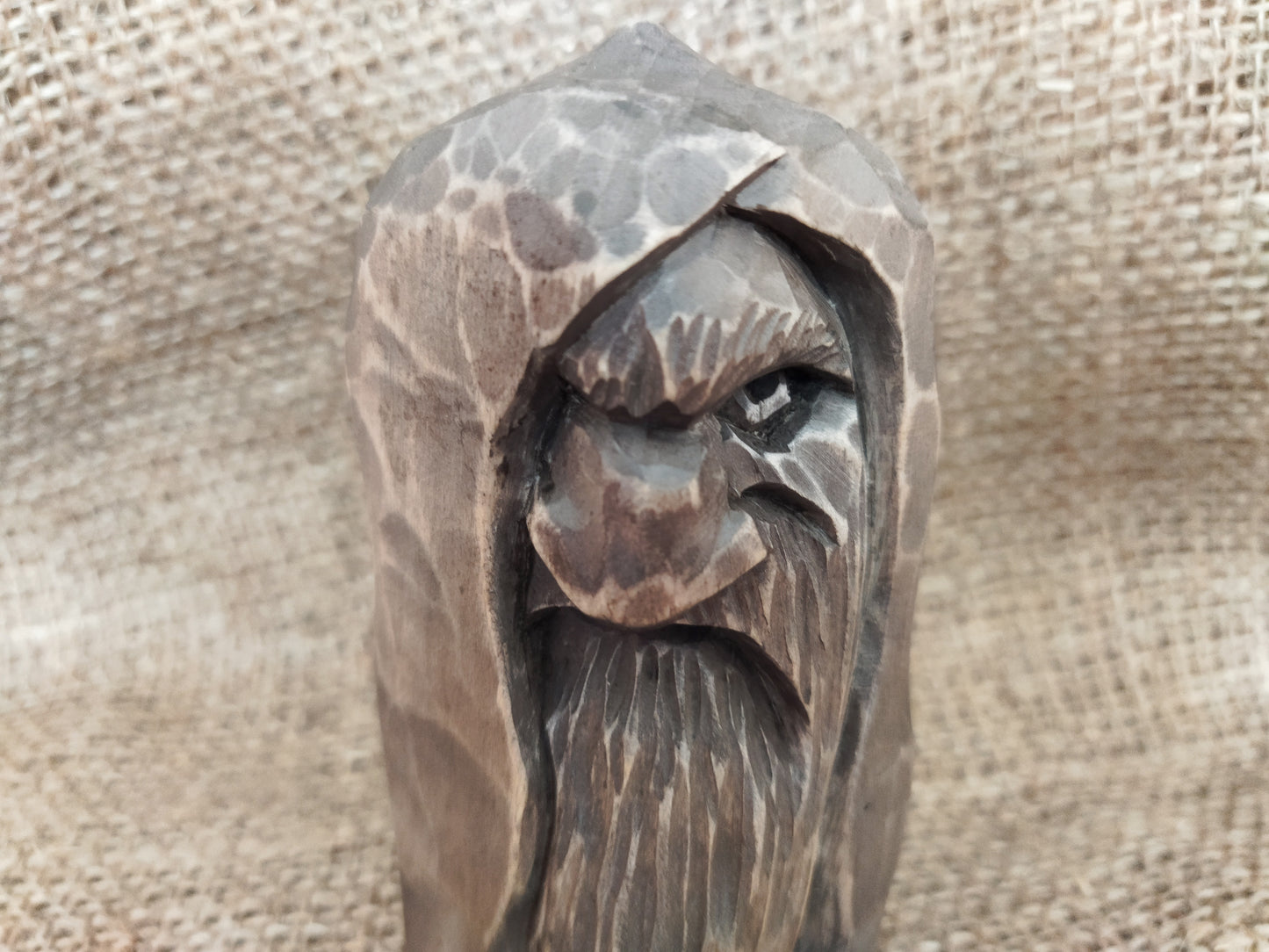 Odin statue. Wood carving. Scandinavian mythology.