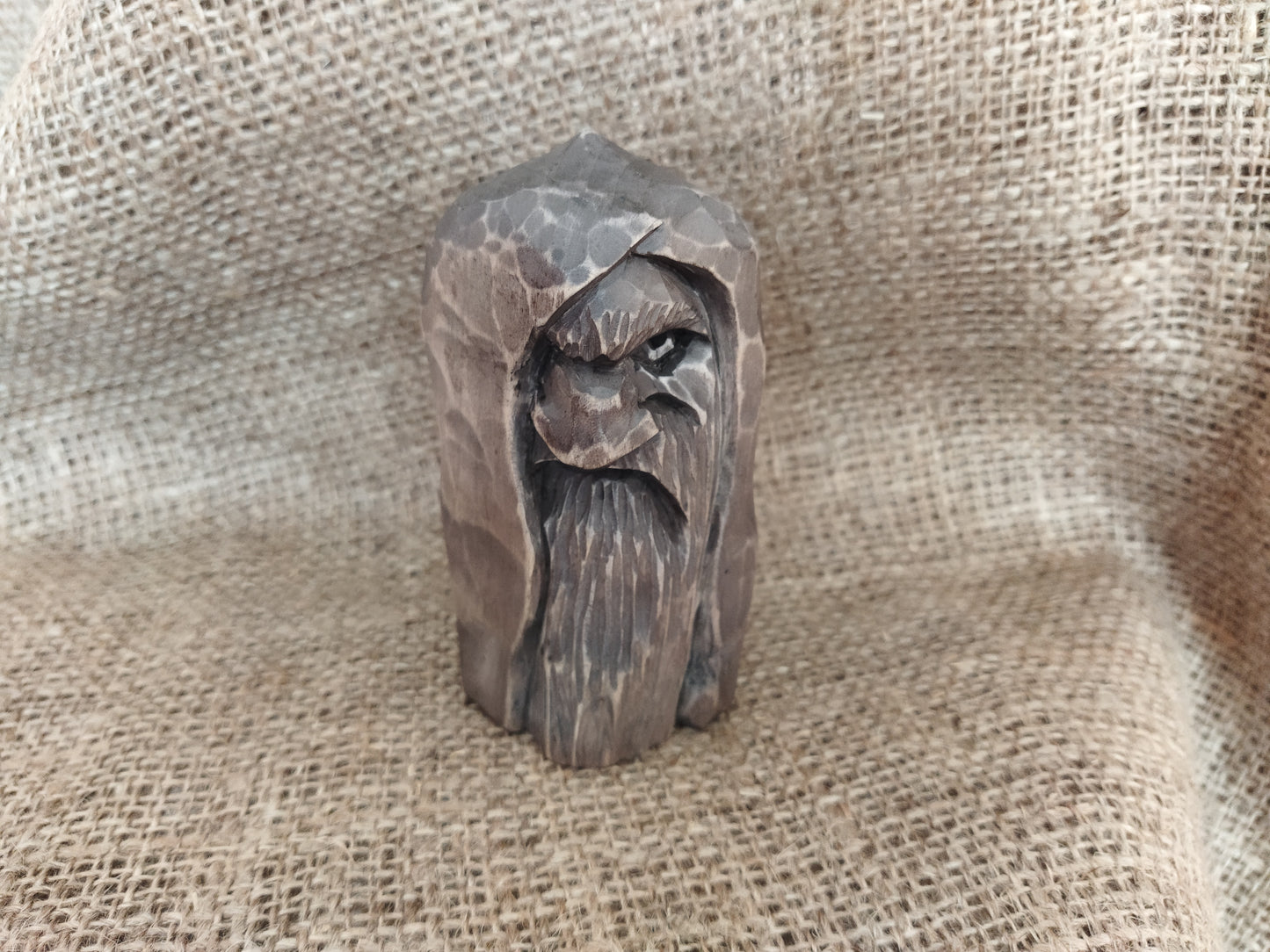 Odin statue. Wood carving. Scandinavian mythology.