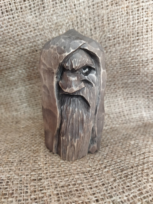 Odin statue. Wood carving. Scandinavian mythology.