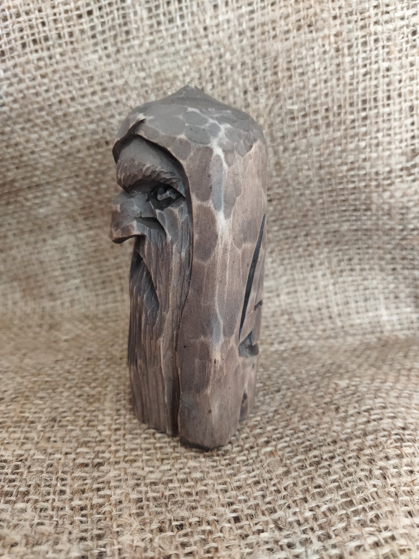 Odin statue. Wood carving. Scandinavian mythology.