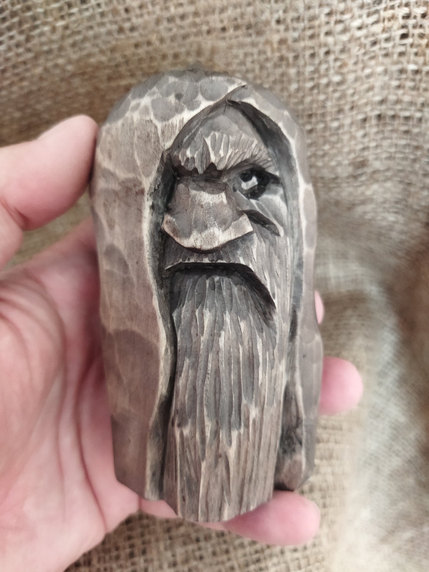 Odin statue. Wood carving. Scandinavian mythology.