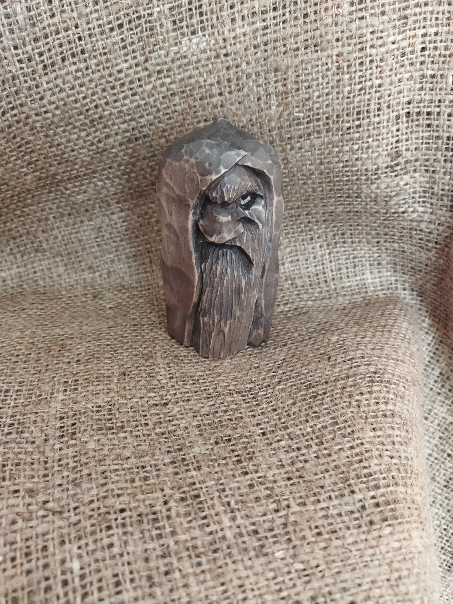 Odin statue. Wood carving. Scandinavian mythology.