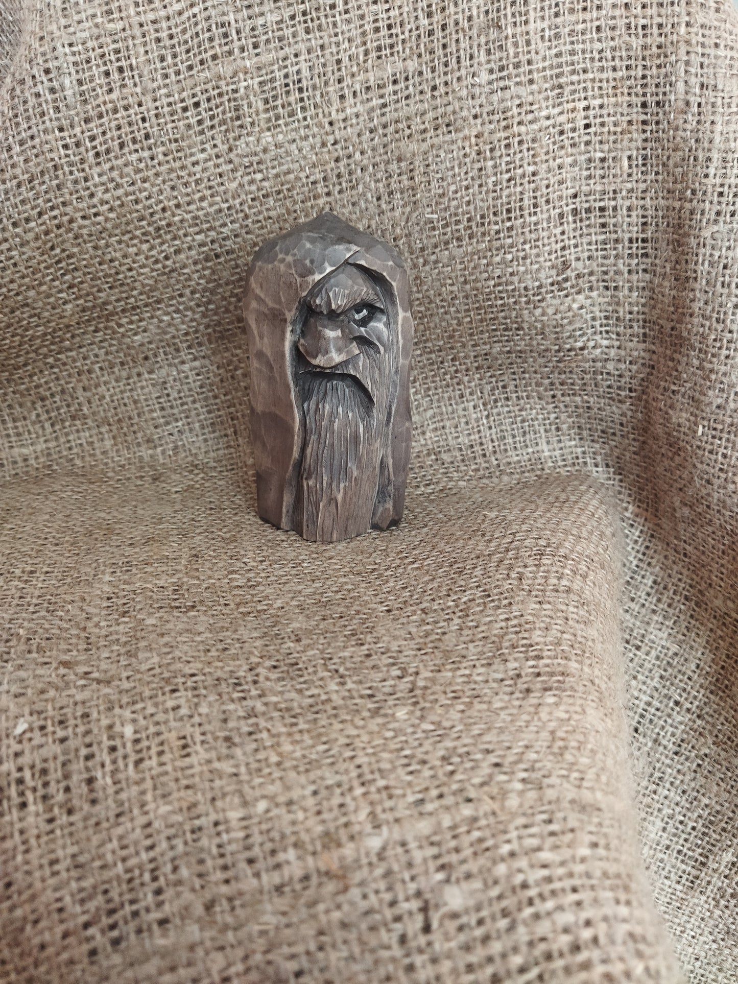 Odin statue. Wood carving. Scandinavian mythology.