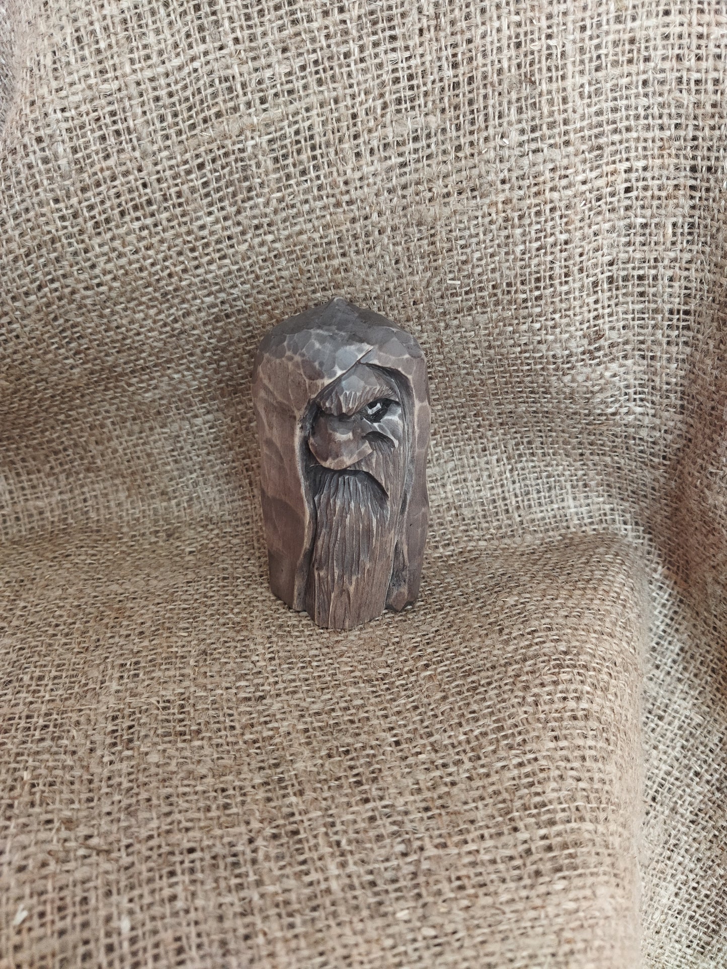 Odin statue. Wood carving. Scandinavian mythology.