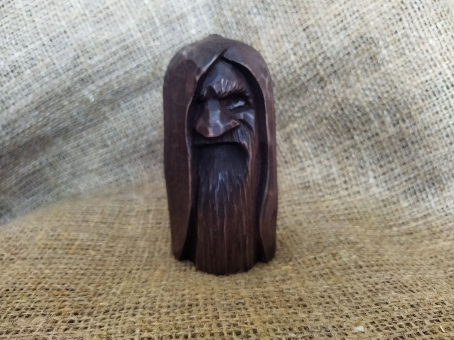 Odin statue. Handmade wooden statue of the god Odin 