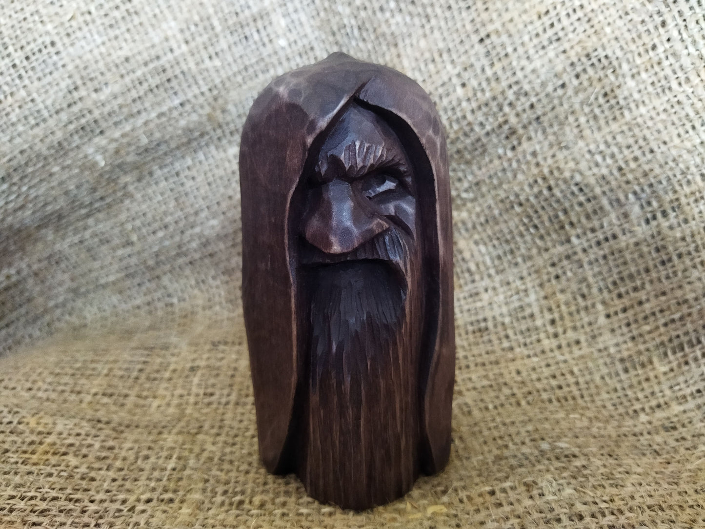 Odin statue. Handmade wooden statue of the god Odin 