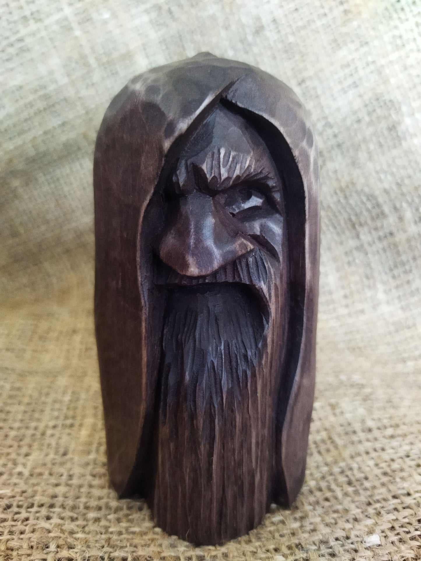 Odin statue. Handmade wooden statue of the god Odin 