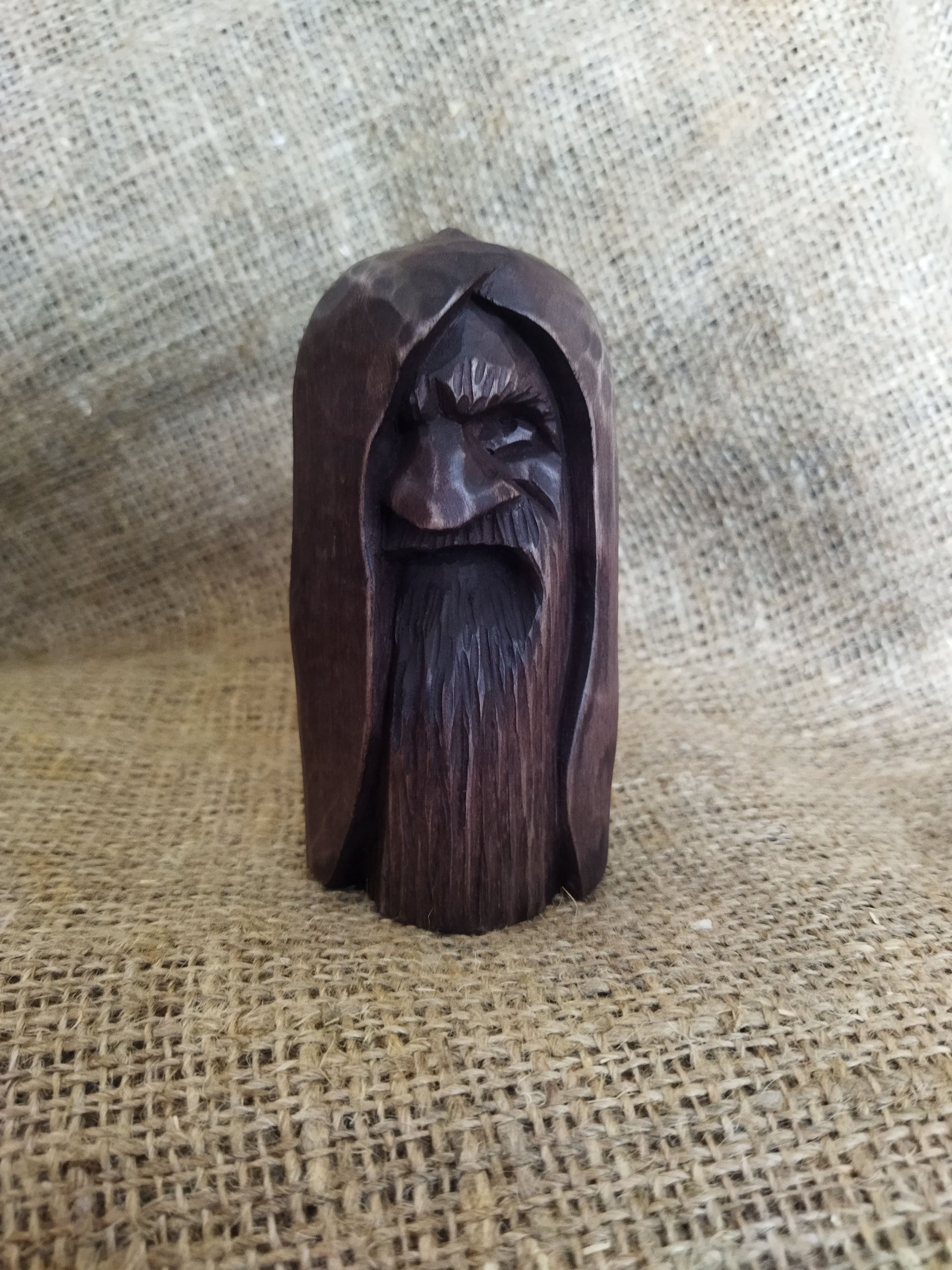 Odin statue. Handmade wooden statue of the god Odin 