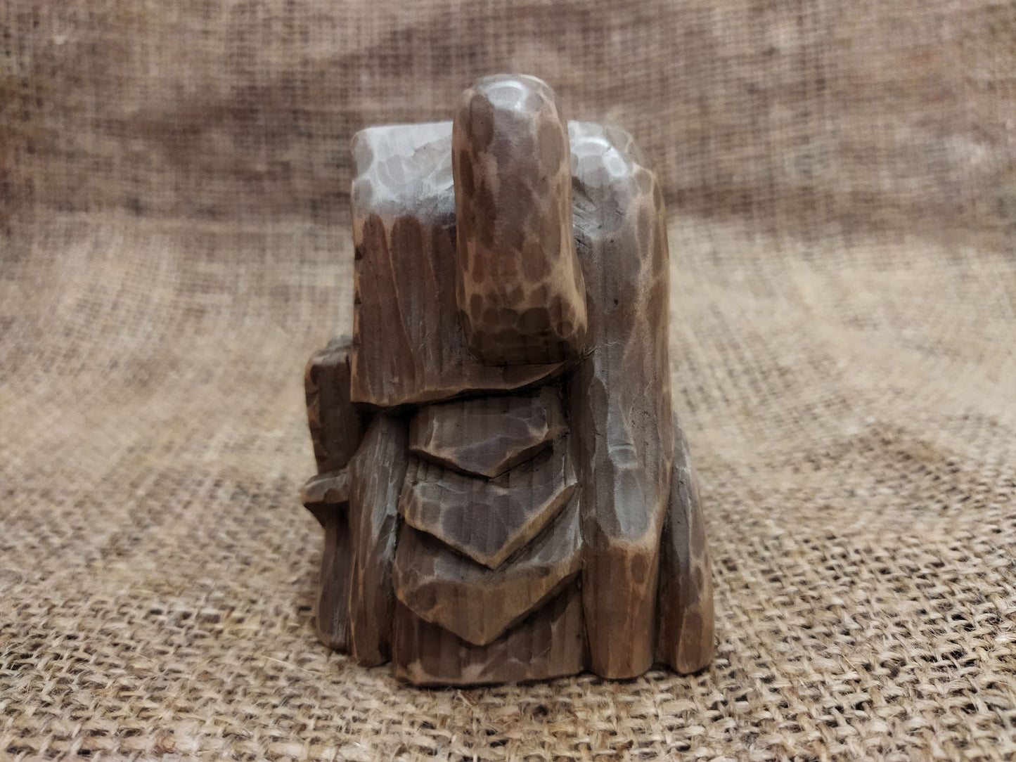 Odin figurine. Handmade statuette of the god Odin. Wood carving.