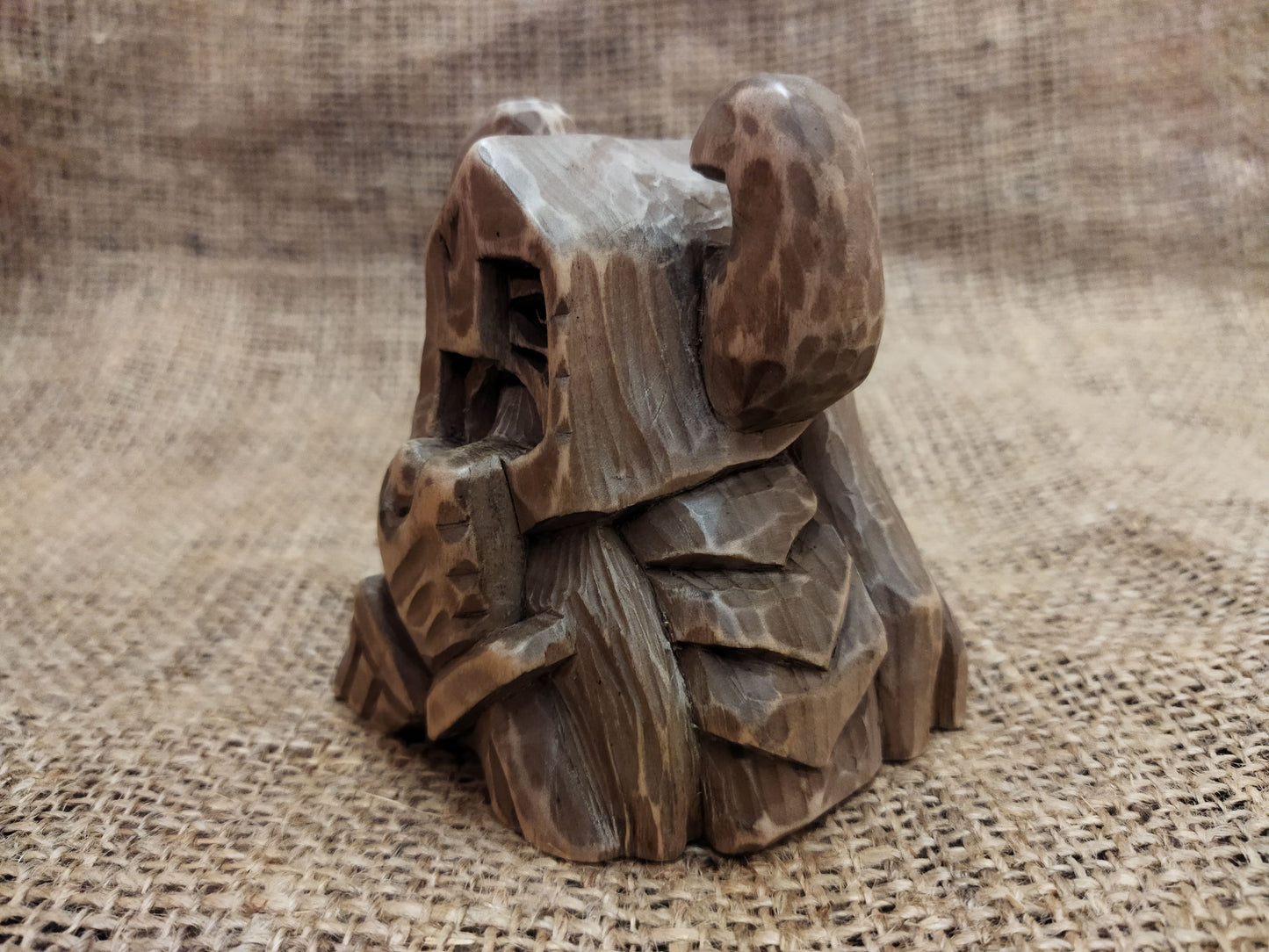 Odin figurine. Handmade statuette of the god Odin. Wood carving.