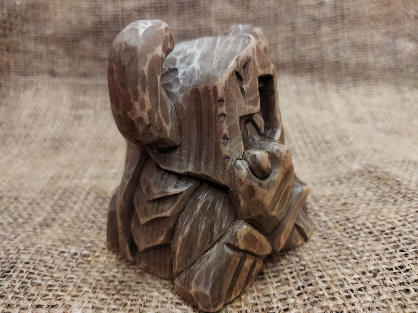 Odin figurine. Handmade statuette of the god Odin. Wood carving.