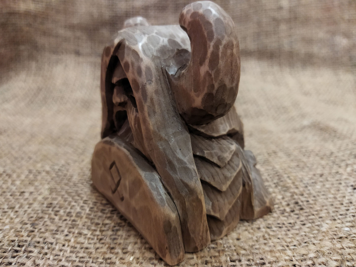 Odin figurine. Handmade statuette of the god Odin. Wood carving.