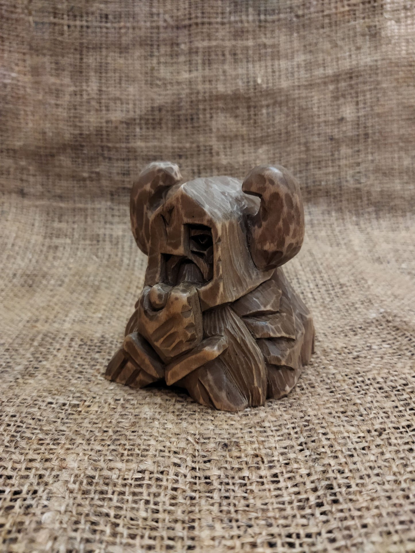 Odin figurine. Handmade statuette of the god Odin. Wood carving.