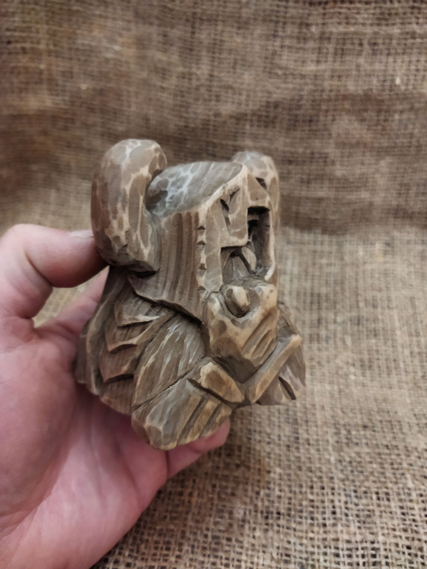 Odin figurine. Handmade statuette of the god Odin. Wood carving.