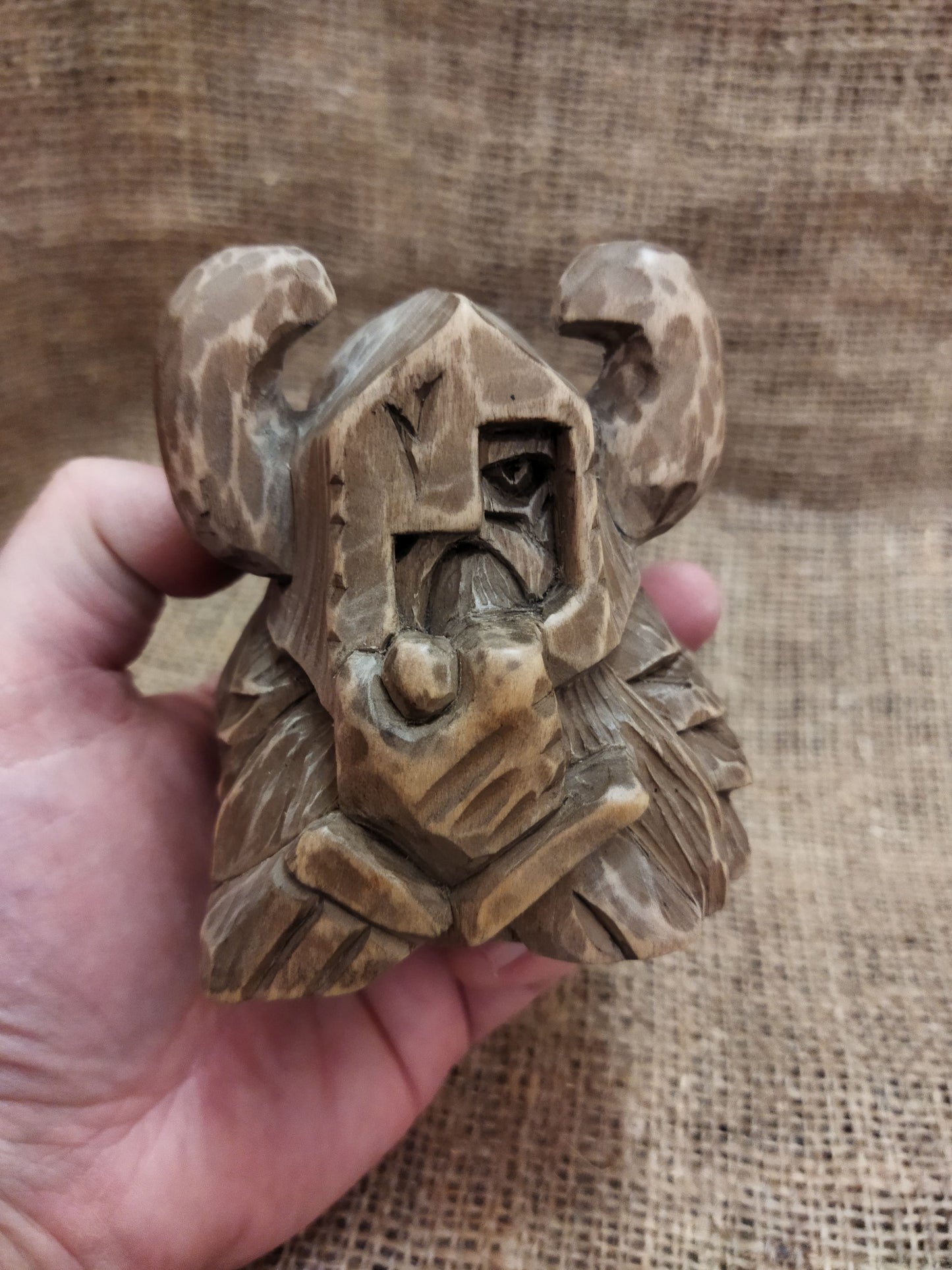 Odin figurine. Handmade statuette of the god Odin. Wood carving.