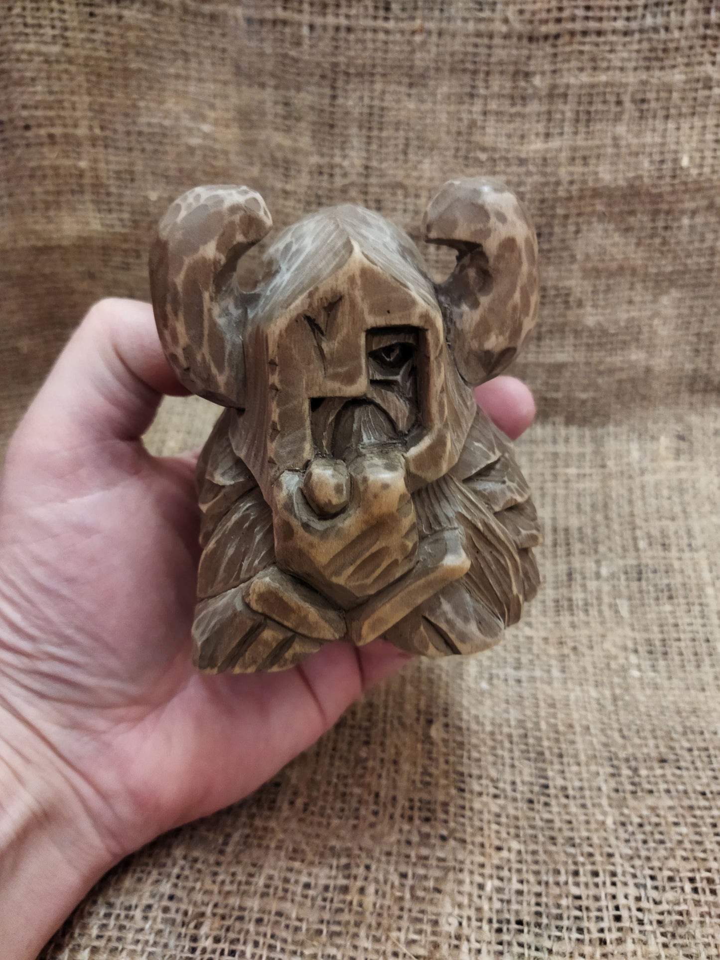 Odin figurine. Handmade statuette of the god Odin. Wood carving.