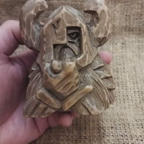 Odin figurine. Handmade statuette of the god Odin. Wood carving.