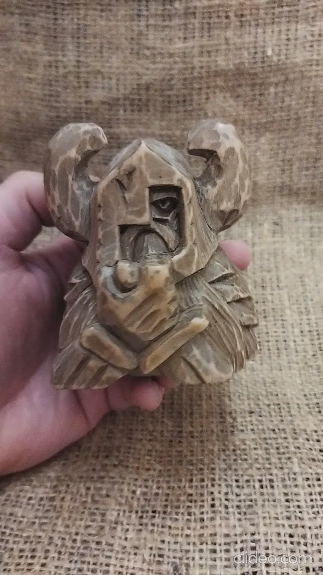 Odin figurine. Handmade statuette of the god Odin. Wood carving.